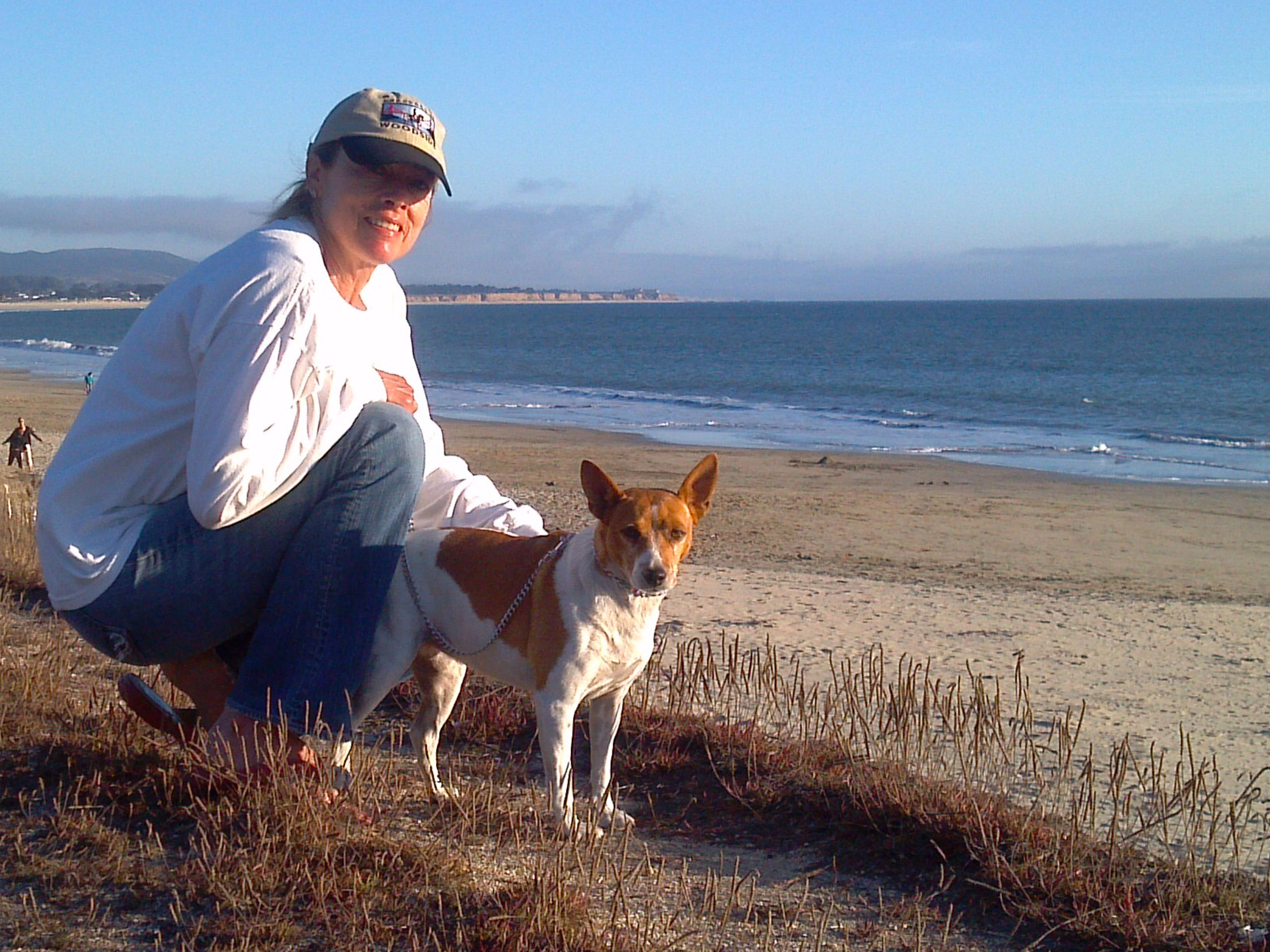 Renee Johnson with Goldie at the beach after the rat terrier's surgery.