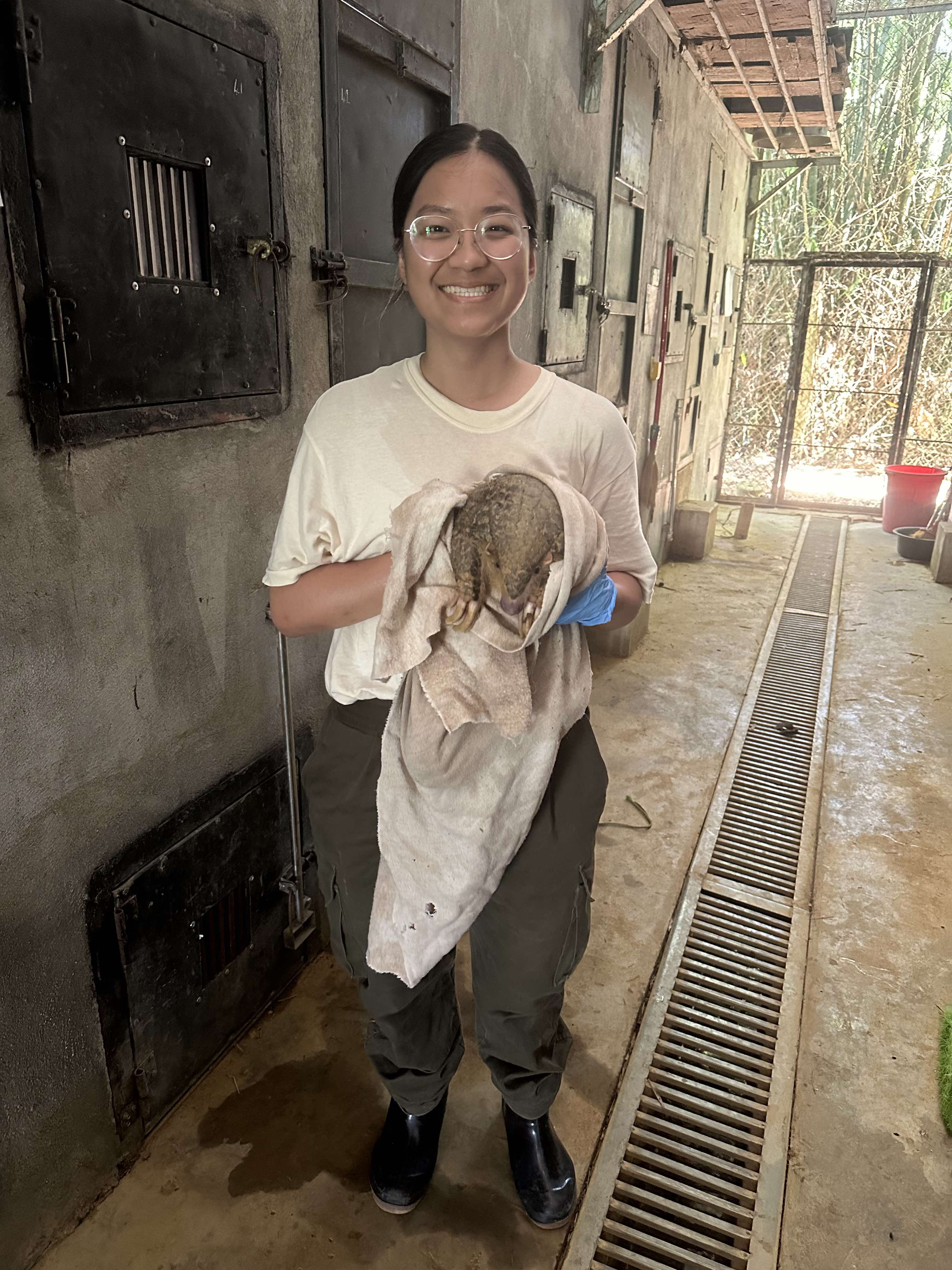 Anh holding an aardvark.