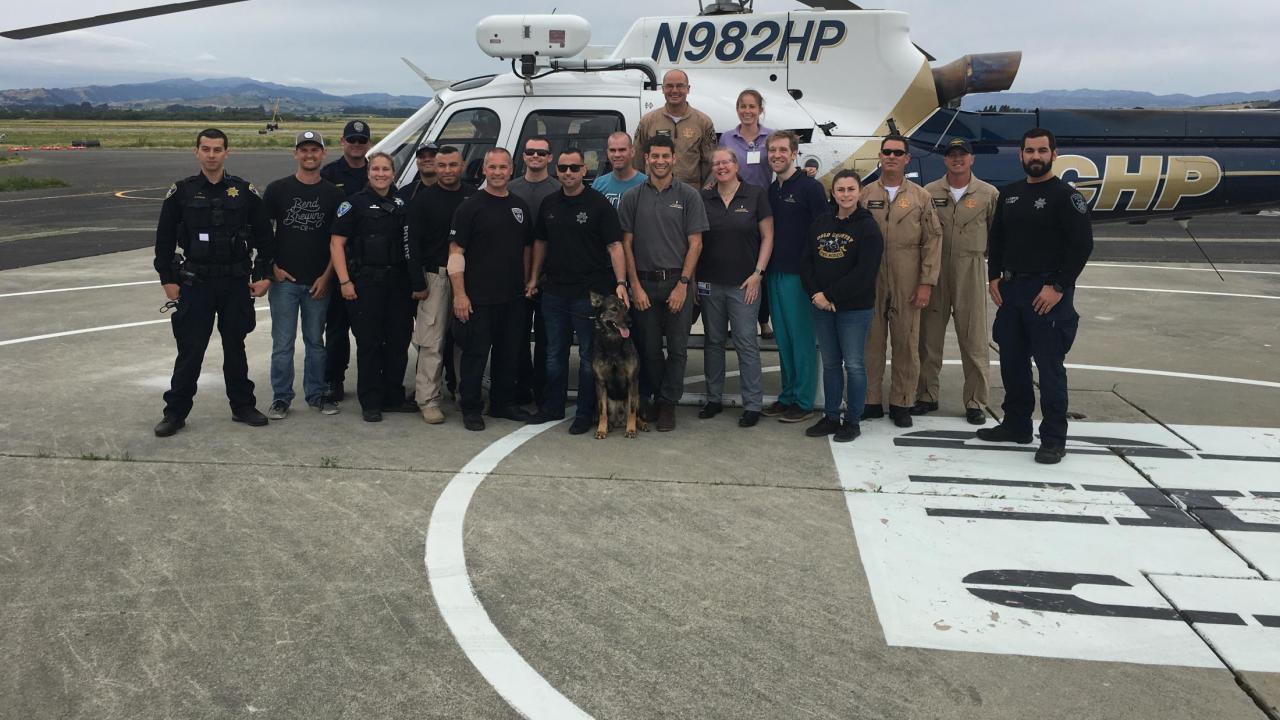 UC Davis veterinarians administered first aid training to K9 handlers at the CHP Air Rescue Operations Unit headquarters. Police and UC Davis veterinarians with CHP helicopter