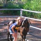 Pedro the goat with young family member