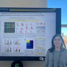 veterinarian with research poster