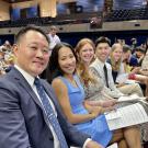 Group of students at white coat ceremony sitting in a row