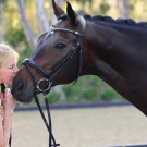 woman kissing horse